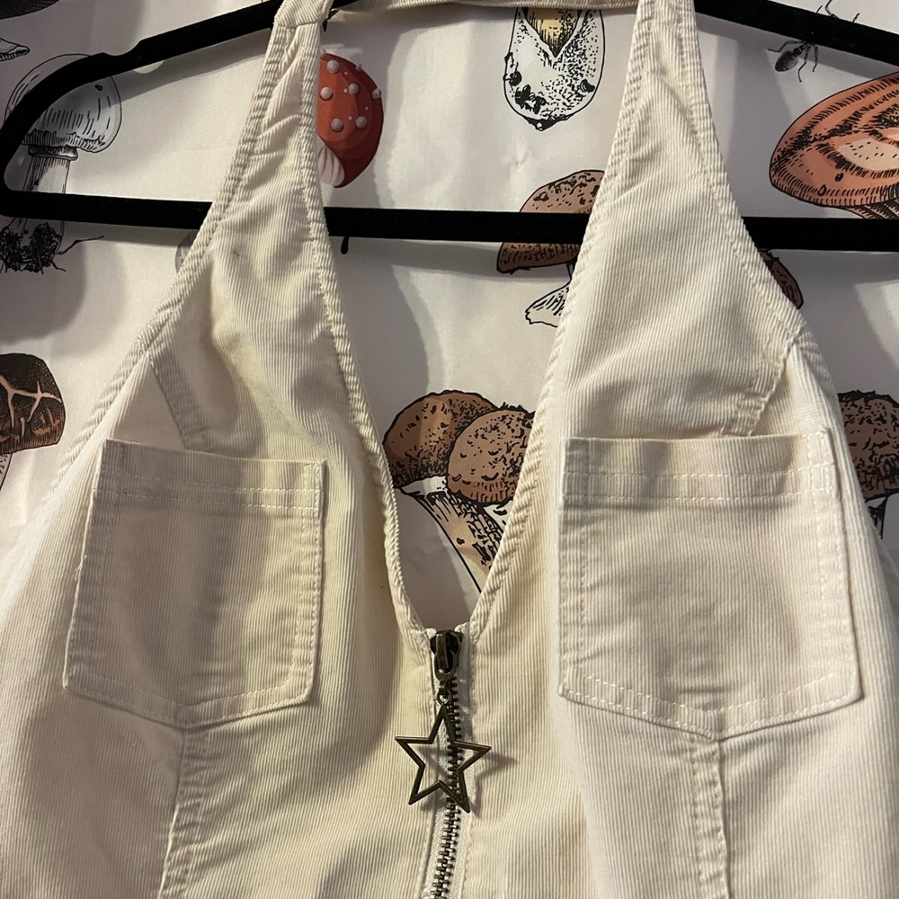 Halter shorts jumpsuit with star keychain zip up in the front. - Picture 3 of 7